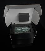 6 inch tall Canadian handcrafted Kiln Formed casted Clear Glass waterfall award statue, that sits on top of a black glass base the award sits inside of a black and white gift box with foam surrounding the award in front of a black studio background