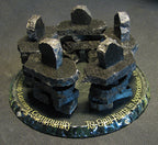 5 Handcrafted black chipped granite  Inukshuks, standing in a circle, on top of a clear chipped edge glass base with gold etching 
