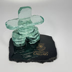 Handcrafted 4.5 inch tall clear glass inukshuk on top of a black polished granite chipped edge base with gold etching on top