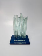 Glass Waterfall sculpture on a blue base with 'LIEBHERR' branding
