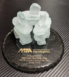 Manitoba Institute of Agrologists award with three frosted glass inukshuk sculptures on a black painted glass base with gold etching.